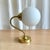 Cute hungarian industrial brass wall light with spherical milk glass shade, 1970s. Brass matched with milk glass...