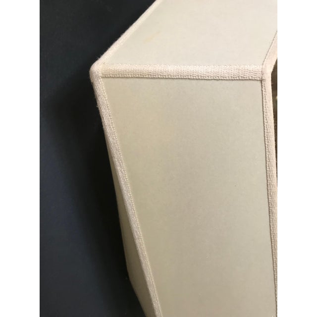 Wonderful polygonal shaped elements out of clear champagne colored fabric. The elements are clamped between architectonic...