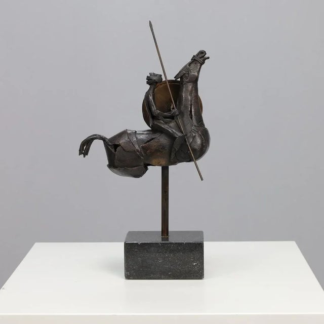 A powerful and expressive bronze sculpture merging movement, conflict, and mysticism. The rider, suspended between heaven...