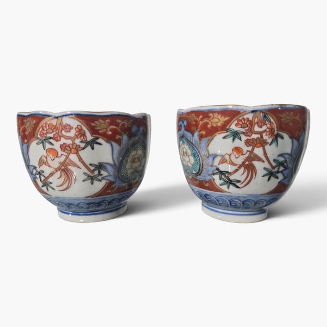 We are proud to present a stunning, highly collectible pair of antique Japanese Kutani / Imari porcelain tea cups dating...