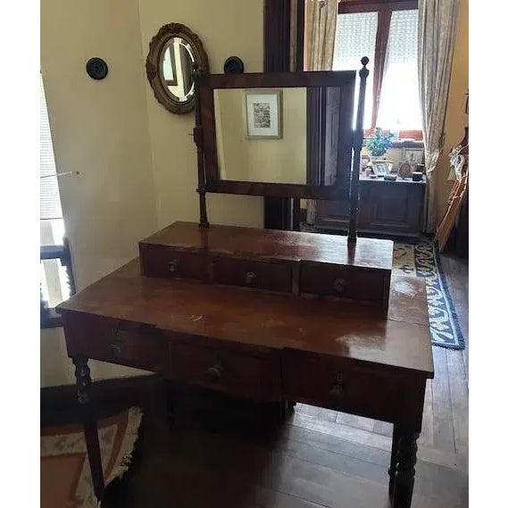 19th century Portuguese, in oilwood with rosewood frames, lower part with three drawers. Upper part with three drawers....