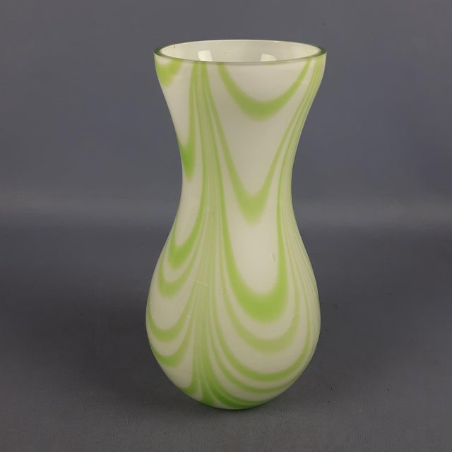 An elegant Murano glass vase attributed to the renowned Carlo Moretti glassworks, dating back to the 1970s. This piece is...