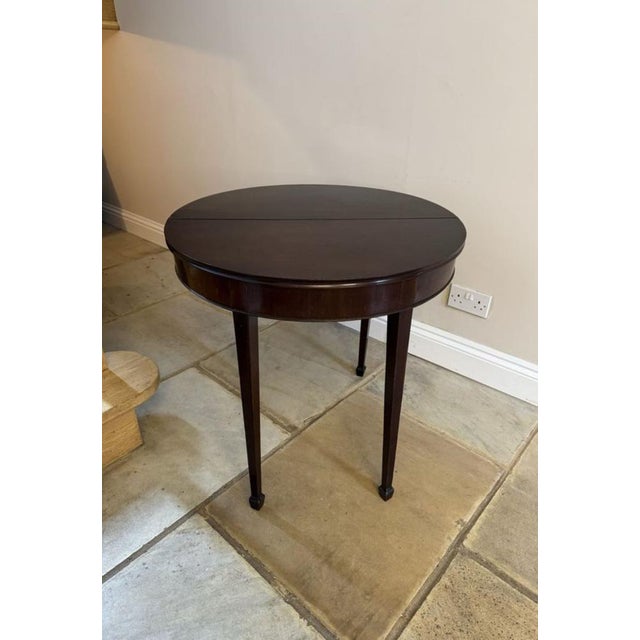 Antique george iii quality figured mahogany demi-lune shaped tea table, having a quality figured mahogany demi lune shaped...