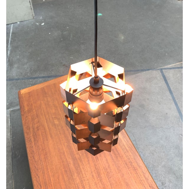 Rare lamella pendant lamp from Lyfa. Probably a design by Luigi Weisdorf. The lamp convinces with its clear geometry. The...