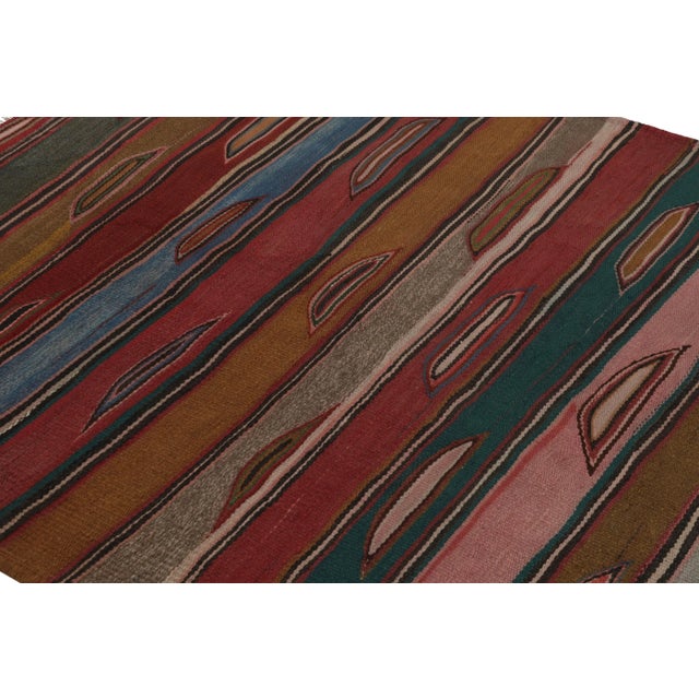 Made with handwoven wool in Persia 1950-1960, this 6x6 vintage Heriz square Kilim is a particularly bright and sought-...