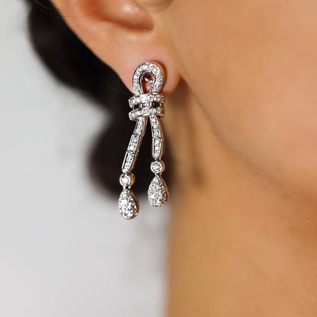 18k White gold earrings with 126 pave set diamonds weighing approximately 2.50 carats. 19.59 grams
