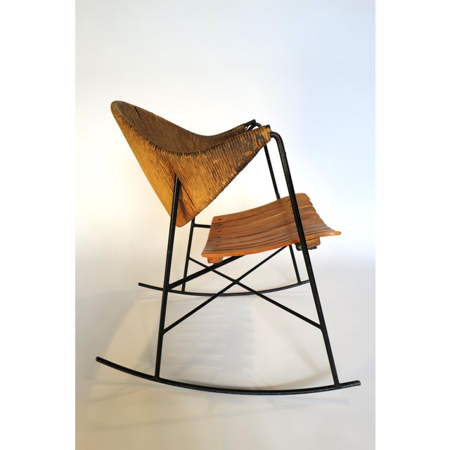 The Arthur Umanoff rocking chair is a timeless piece of furniture that combines elegant design with exceptional comfort....