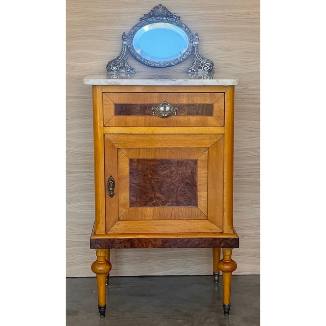 Louis XVI style pair of Marquetry nightstands with bronze crest one drawer and one compartment. Originals handles and...