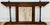 Antique English oak hall tree featuring six (6) double hooks for hanging. Rich deep stain with barley twist accents and...