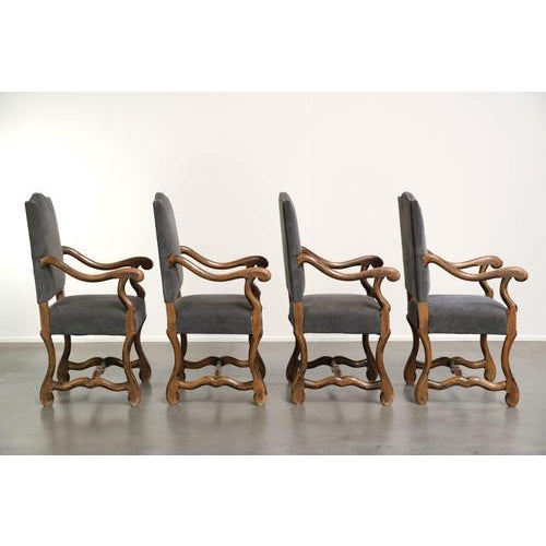 This set of 14 Os de Mouton dining chairs dates from the late 19th century. The chairs feature a spacious, comfortable...