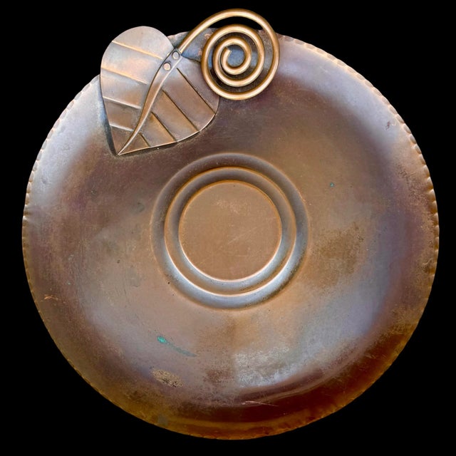 This vintage copper charger by Francisco Rebajes exemplifies the artist’s modernist approach to functional art. Hand-...
