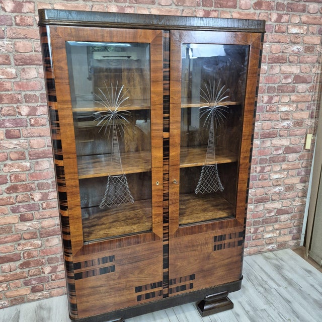 A remarkable and highly decorative European Art Deco display cabinet, dating from approximately 1928–1934. Probably...
