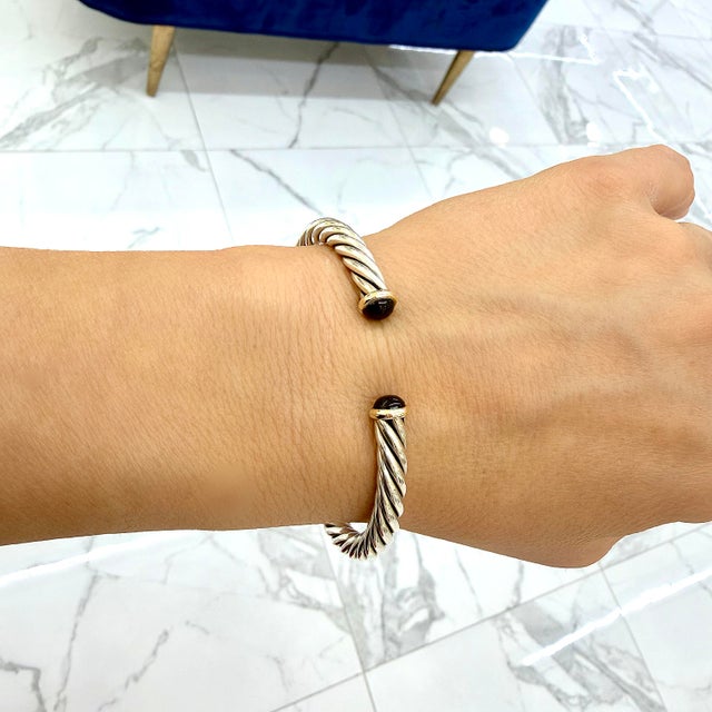 Brand: David Yurman Gender: Men’s Metal Type: 14K Yellow Gold & 925 Silver Length: 8.00 inches Width: 6.00 mm Weight:...