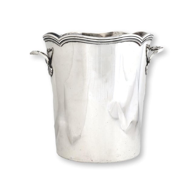 Late 19th century French silverplate ice bucket featuring a classic tapered cylindrical form with softly undulating rim...