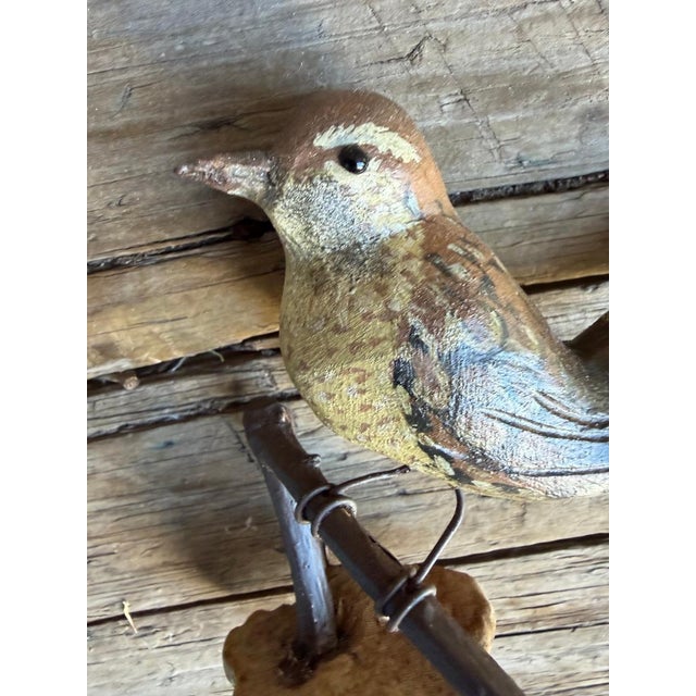 A folk art bird from Austria — hand carved wood. Measures 4.75" x 4" x 2". A charming folk-art carving for a shelf,...