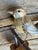 A folk art bird from Austria — hand carved wood. Measures 4.75" x 4" x 2". A charming folk-art carving for a shelf,...
