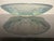 This Art Deco bowl, made of heavy glass, features striking relief birds on its underside and can be used as a decorative...