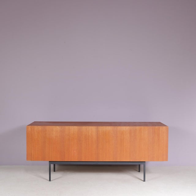 This elegant 1950s teak sideboard, model B20, was designed by Dieter Wäckerling for Behr, Germany. The warm tones and...