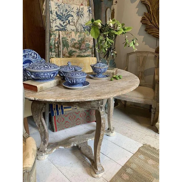 A handsome C18th Swedish baroque oak console/Demi lune . In a lovely light bleached oak retaining some traces of original...