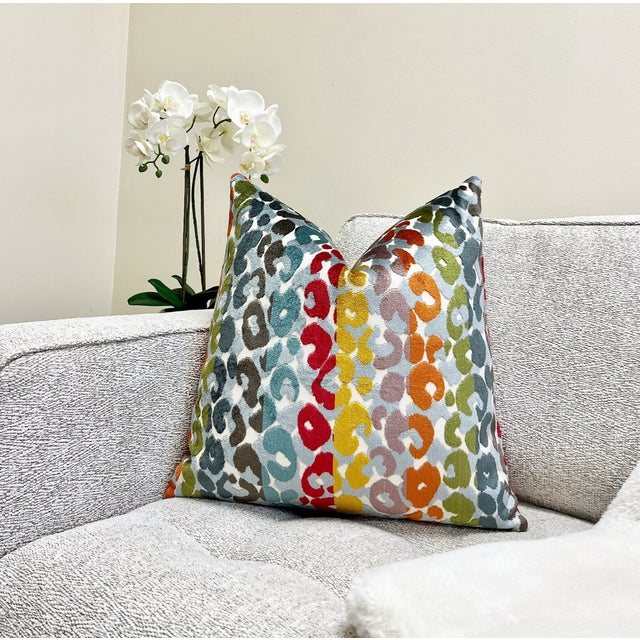 This bright and colorful velvet pillow will make a statement in any room. It's a modern stripe pattern of vibrant...