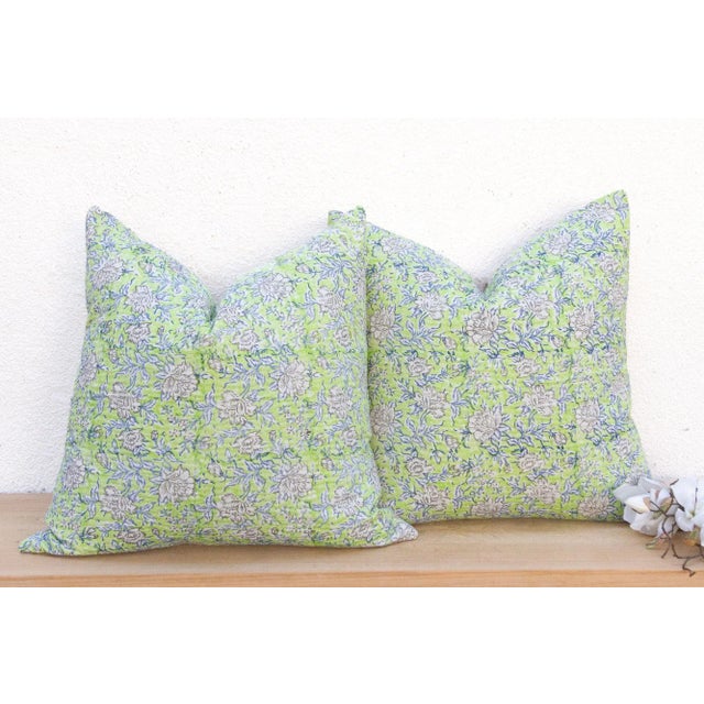 This magnificent pair of decorative pillows is a celebration of dual textile artistry. Each large 24-inch square pillow is...