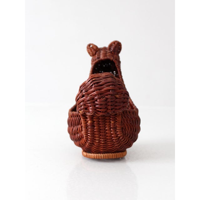 Charming vintage wicker squirrel basket with a beautifully woven form, curled tail, and acorn detail. Crafted in warm,...