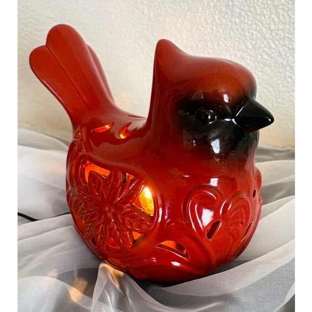 Often used as a decrative holiday light, this vintage ceramic cardinal bird with poinsetta cutout accents allows the light...