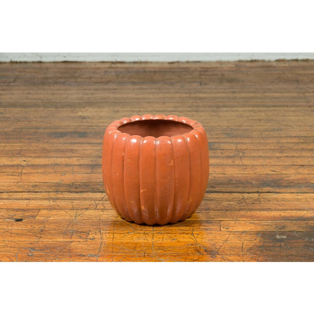 A Japanese Taisho period handmade pumpkin-shaped planter from the early 20th century, with distressed marks. Crafted in...