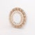 Executed in the iconic radiant form, the mirror features a circular looking glass surrounded by boldly carved rays,...