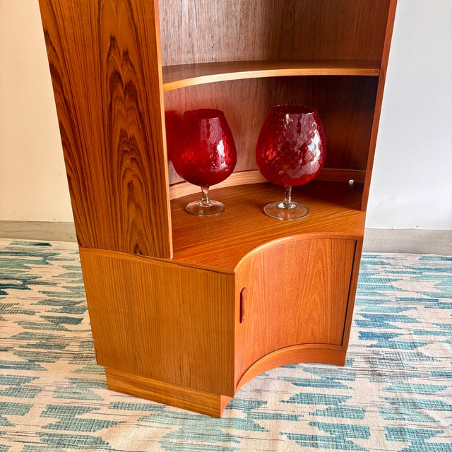 Striking mid-century modern corner cabinet by G Plan, crafted in warm-toned teak and designed to maximize both form and...
