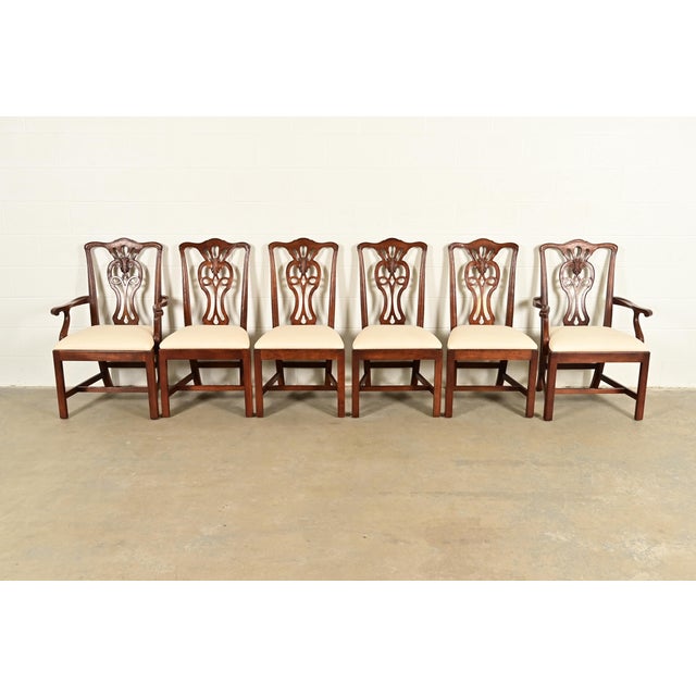 A gorgeous set of six Georgian or Chippendale style dining chairs By Henredon USA, Circa 1980s Carved mahogany frames,...