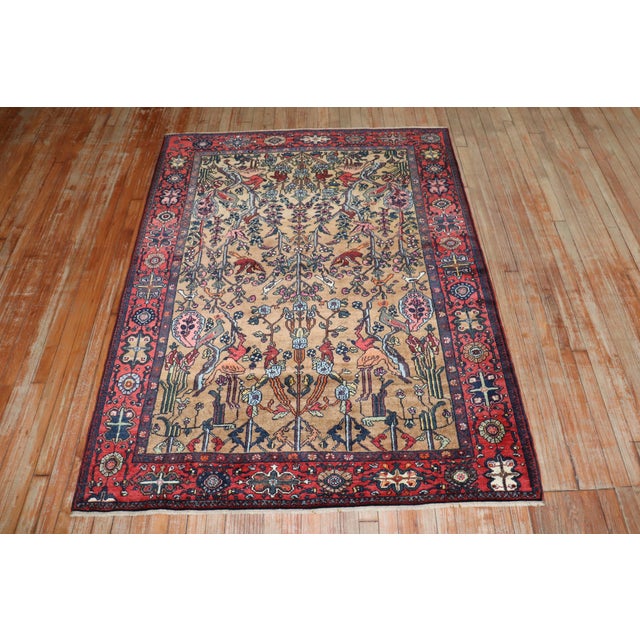An early 20th century Persian pictorial rug Measures: 4'19'' x 6'3''.