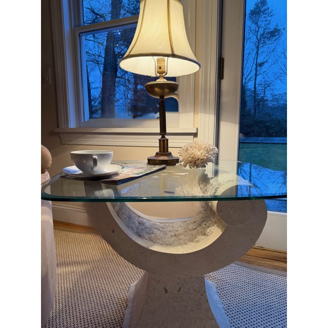 Tessellated Travertine Sculptural Crescent Pedestal Cocktail/ Drinks/Side Table With Beveled Glass Top Some tables quietly...