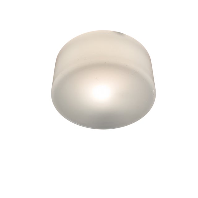 A stylish pair of ceiling lights designed by Paavo Tynell and manufactured by Idman in Finland during the 1950s (model...