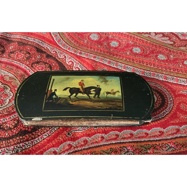 AN EARLY 19TH GERMAN STOBWASSER TYPE PAINTED LACQUER CARD CASE OF RACING THEME of rectangular form with curved ends,...