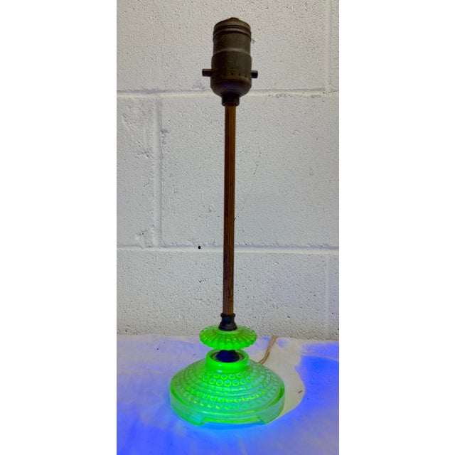 Up for sale is a lovely antique table lamp featuring vaseline glass that glows exquisitely under blacklight. It has a...