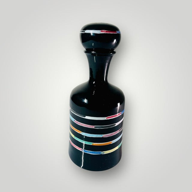 Beautiful ceramic decanter with stopper, designed by famous artist Piero Dorazio for Deruta, Italy. This piece has an...