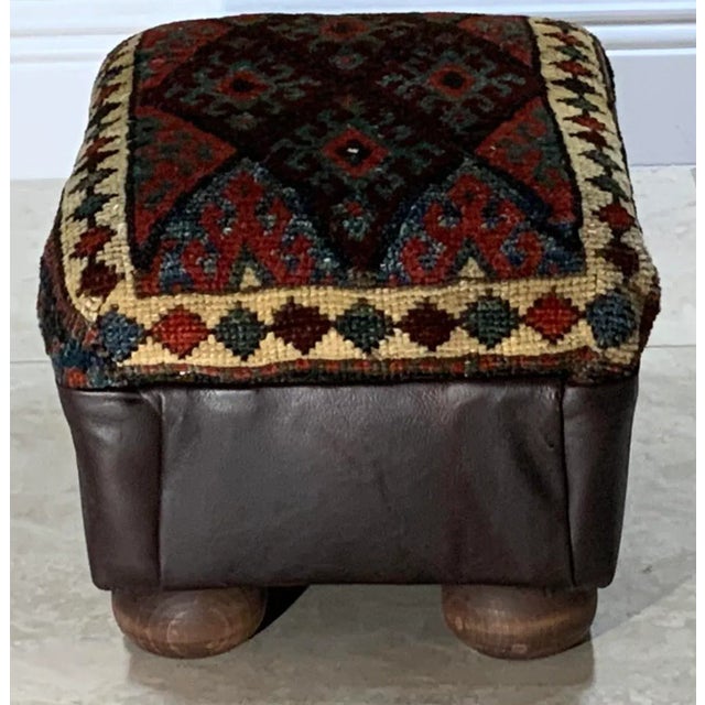 Funky foot stool made of wood, upholstered with beautiful hand woven Vintage Kurdish bag face collectable rug, repeating...