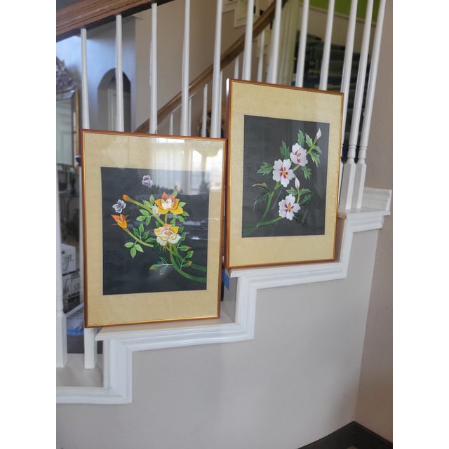 This elegant pair of vintage Asian silk embroideries features finely stitched flowering branches set against a deep,...