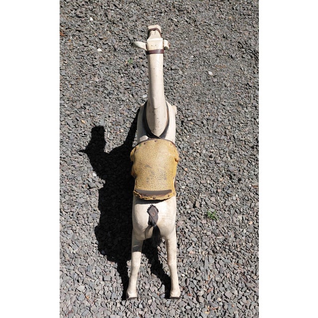 Vintage Child's Rocking Horse Toy. It is 34' wide x 20.5" high x 6" wide. Some losses to feet and paint. Would make a...
