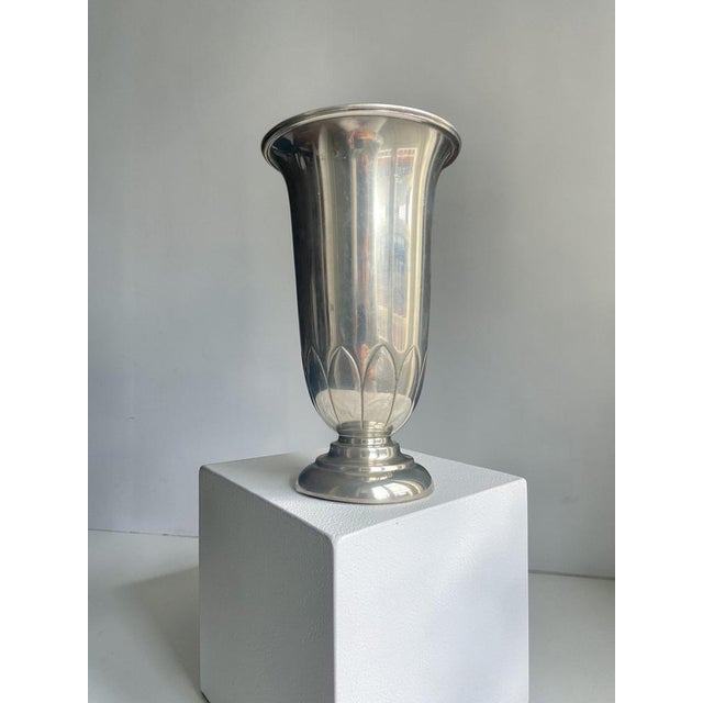 Elegant swedish art deco pewter vase produced by c.g. Hallberg, dated 1929. The vase features a refined trumpet form with...