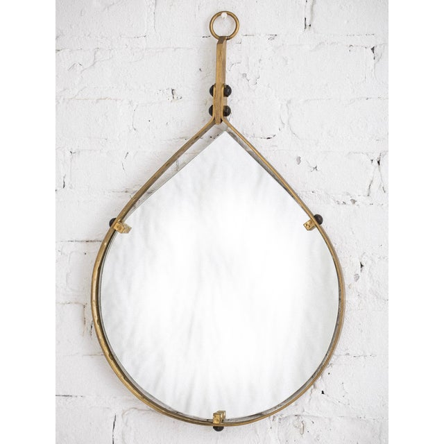 Mid-century teardrop shaped wall mirror with brass frame, circa 1970s. Attributed to Santambrogio and De Berti. Sourced in...