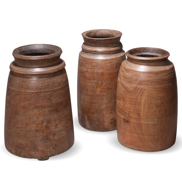 Authentic Rajasthani Storage Vessels, Mid-20th Century Discover the soul of rural India with these hand-carved wooden...