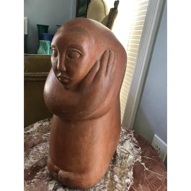 Mid-Century modern abstract statue of a woman. Finely sculpted figure of a woman with her arms wrapped around herself in a...