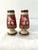 Lovely set of ceramic salt and pepper shakers in Fitz and Floyd's "Holiday Solstice" pattern with plastic stoppers.