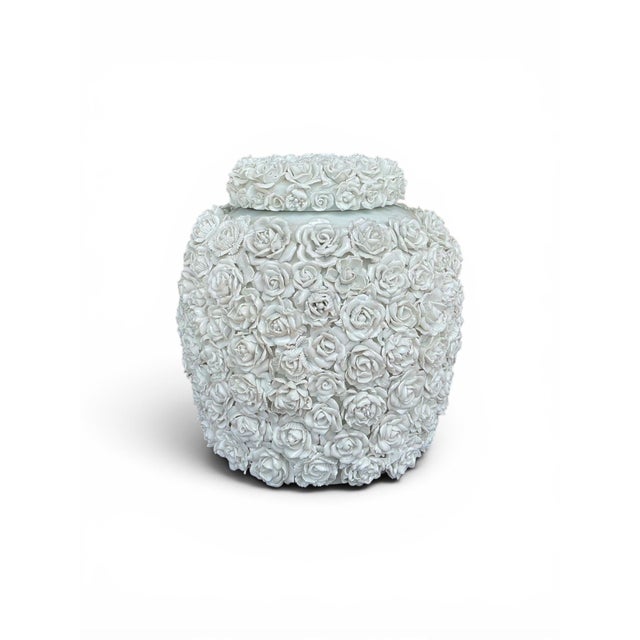 This is a Blanc de Chine style porcelain ginger jar hand crafted for Tozai Home. The body is porcelain, and the roses are...