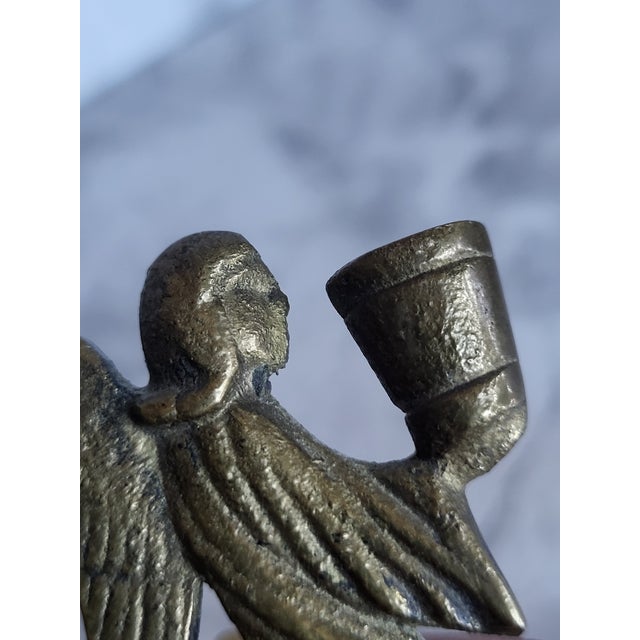 Stamped West Germany and possible made during the WWII era. This stylized praying angel is solid brass and holding a...