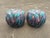 Original Pair of 1980s poofs by Weiman Furniture. An original upholstered, graffiti style with vibrant colors. They are...