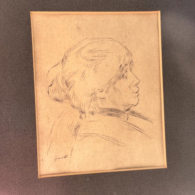 This is a lovely antique etching by Pierre Auguste Renoir of Berthe Morisot. It is framed and matted with a charcoal grey...