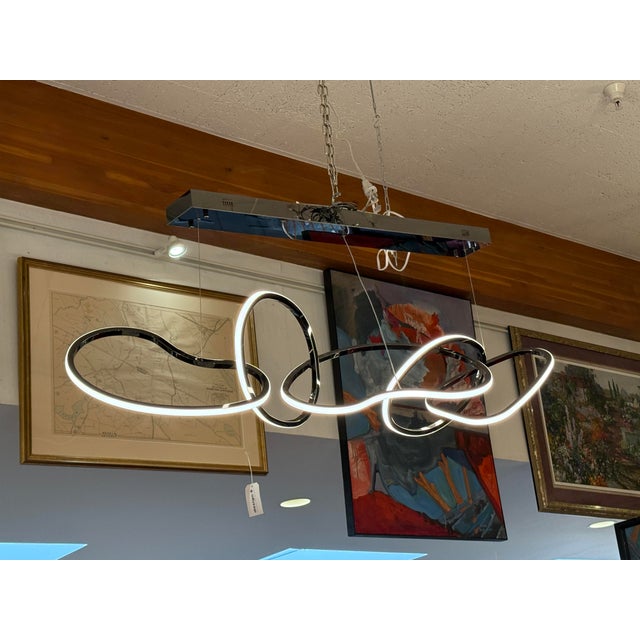 Design Plus Gallery presents the Brushed Chrome Unity Chandelier from ETA Lighting. This linear pendant is a contemporary...